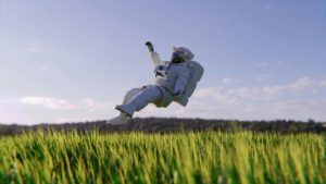 Video channel showing a man in a spacesuit flying across a field of grass.